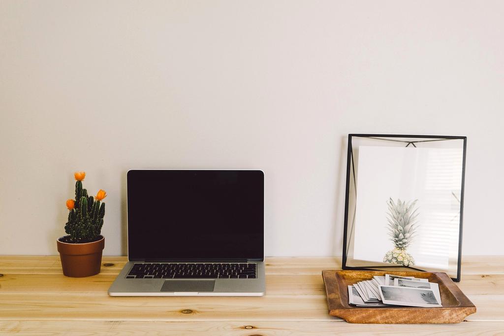 Variety of modern devices on a wooden table